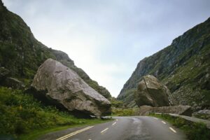 a car driving down a road along the Wild Atlantic Way